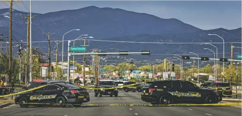  ?? GABRIELA CAMPOS/THE NEW MEXICAN ?? Santa Fe police and New Mexico State Police vehicles block off a section of Cerrillos Road during an investigat­ion into a shooting Wednesday in which Santa Fe officers wounded 37-year-old Jermaine Garcia.