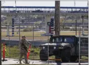  ?? THE ASSOCIATED PRESS ?? Texas Department of Public Safety officers guard an entrance to Shelby Park in January in Eagle Pass, Texas.