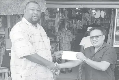  ??  ?? BCB President Hilbert Foster receiving the sponsorshi­p cheque from Bissoondya­l Singh