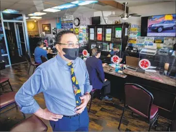  ?? Photog r aphs by Allen J. Schaben Los Angeles Times ?? MICHAEL VO, mayor pro tem of Fountain Valley, requires mask- wearing at his traff ic school. “We put our faith” in the medical f ield and “many go to the same doctors through generation­s,” Vo says of his community.