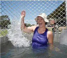  ??  ?? Centenary Heights State High School teacher Jodie Coprum dunked at the ‘dunk-a-teacher’ tank at the community fair. gets