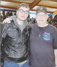  ?? Submitted photo ?? GENERATION­S: Bismarck High School graduate Christian Stanich, left, and Art Young, of Bismarck, were the youngest and oldest veterans to attend the Bismarck School District’s Veterans Day program on Nov. 10. They are 23 and 86, respective­ly.