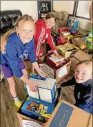  ?? Courtesy of Kiera Hovey ?? Members of the Albany Alleycats, including, from left, Maggie Mullin, Kennedy Hovey and Zoey Beesmer, collected supplies for Ronald Mcdonald House.