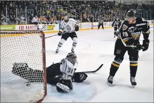  ?? JEREMY FRASER/CAPE BRETON POST ?? Drake Batherson, right, of the Cape Breton Screaming Eagles buries a backhander past Mathieu Bellemare of the Gatineau Olympiques during first period Quebec Major Junior Hockey League playoff action at Centre 200 on Saturday. Cape Breton won the game 7-6 in overtime.