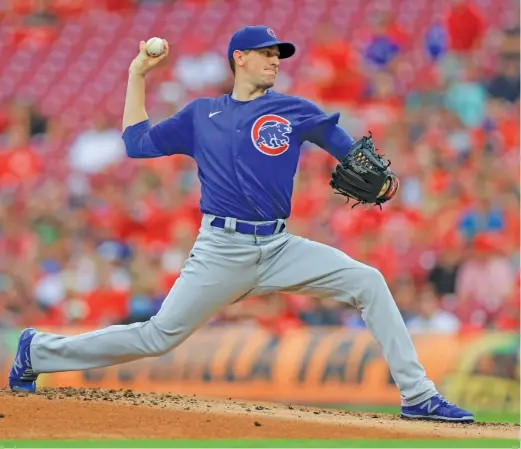  ?? AARON DOSTER/AP ?? Kyle Hendricks pitches against the Reds on Tuesday night en route to his 14th win of the season. He allowed just one run and three hits in six innings.