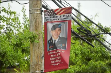  ?? PETE BANNAN — DIGITAL FIRST MEDIA ?? Upland Borough honors hometown heroes including Sgt. Jeffery C.S. Sherer, who died in Afghanista­n in 2011.