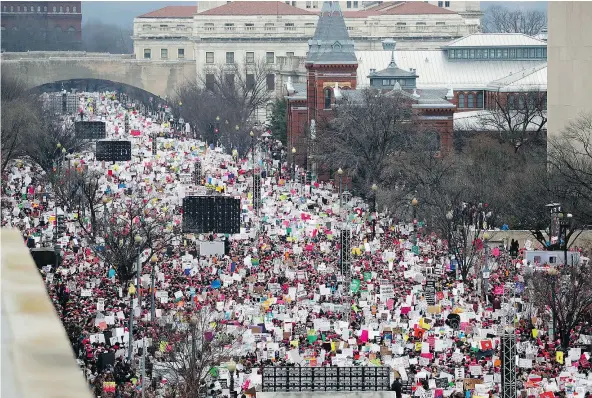  ?? — PHOTOS: AP ?? Independen­ce Avenue burst with protesters during Saturday’s Women’s March on Washington. The overall crowd exceeded 500,000.