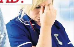  ??  ?? STRESSED NHS worker looks exhausted after another gruelling shift