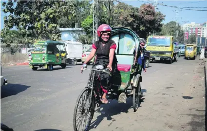  ?? AFP ?? Mosammat Jasmine, 45, took up her challengin­g job because she was determined to provide an education for her three children.