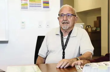  ?? Farmington Municipal Schools via AP file 2019 ?? Gerald Bonds, 86, speaks with colleagues at Farmington High School in Farmington, N.M. Bonds, 86, in his 58th year of teaching at Farmington High School, like most teachers in his state has been instructin­g his students remotely — an arrangemen­t he despises.