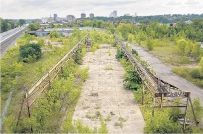  ?? MARK MIRKO PHOTOS/HARTFORD COURANT ?? An abandoned conveyer belt is one of several structures on a 34-acre industrial site in the Parkville neighborho­od. The property was recently foreclosed on by Hartford and is the largest developmen­t site left in the city.