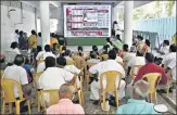 ?? PTI ?? AIADMK workers watch election results at the party headquarte­rs in Chennai on Sunday.
