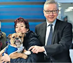  ??  ?? Michael Gove meets bulldog Enid during his trip to Battersea Dogs and Cats Home