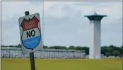  ?? MICHAEL CONROY — THE ASSOCIATED PRESS FILE ?? A “no trespassin­g,” sign is displayed outside the federal prison complex in Terre Haute, Ind.