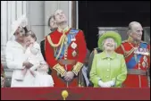  ?? TIM IRELAND/THE ASSOCIATED PRESS ?? Britain’s Queen Elizabeth II smiles with Prince Philip, right, Prince William, center, his son Prince George, front, and Kate, Duchess of Cambridge holding Princess Charlotte, left, on the balcony Saturday at Buckingham Palace.