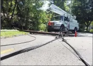  ?? Tyler Sizemore / Hearst Connecticu­t Media ?? Crews repair downed power lines on Angelus Drive in Glenville on Aug. 10, six days after Tropical Storm Isaias hit Greenwich.