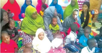  ?? ?? Returnee Chibok girls and their children