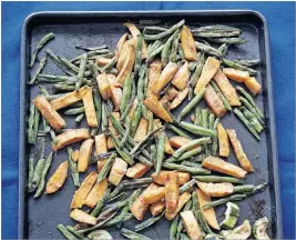  ?? PHOTO BY GHOLAM RAHMAN ?? Vegetables like green beans and sweet potatoes stay sweeter when they are trayroaste­d in the oven, without getting laden with moisture as when they are cooked in water.