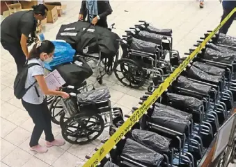  ?? — LIM beng tatt/the Star ?? Catering to all: election workers arranging wheelchair­s for the elderly and disabled before polling day at dewan Sri Pinang in Kuala Lumpur.