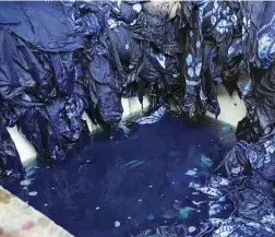  ??  ?? Fabrics soaked with indigo dye in Dali, Yunnan Province, China. “No color
has been prized so highly or for so long,” Catherine E. McKinley writes.