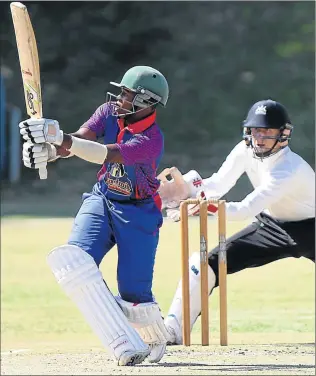  ?? Picture: MICHAEL PINYANA ?? SMASH, BUT NO GRAB: Akhanya Rebe of Hudson Park smashes the ball as Ethan Boucher from Selborne waits for any eventualit­y behind the wickets during their game held at Hudson Park