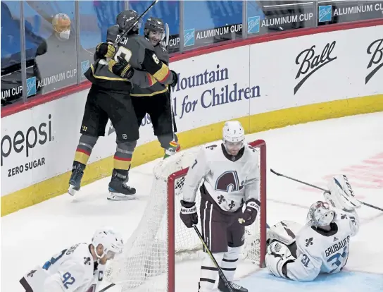  ?? Andy Cross, The Denver Post ?? Vegas right wing Alex Tuch (89), left, celebrates with teammate Max Pacioretty after Pacioretty scored the game-winning overtime goal against Colorado goaltender Philipp Grubauer (31) at Ball Arena on Saturday.