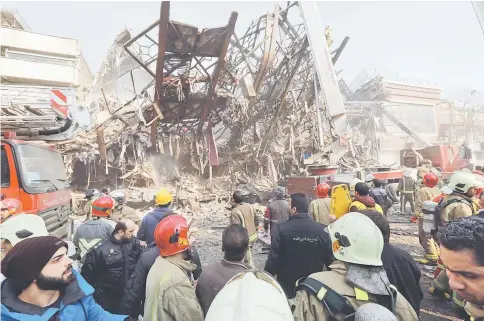  ??  ?? The steel structre of Iran’s oldest high-rise, the 15-storey Plasco building, is seen after the collapse of the building in downtown Tehran. — AFP photo