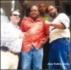  ??  ?? Joey Kulkin photo Olugbala Shababu (orange shirt) stands with friends outside of the old Maxine’s building on South Warren. Shababu is 18 days from opening Your Big Easy restaurant. (Joey Kulkin photo)
