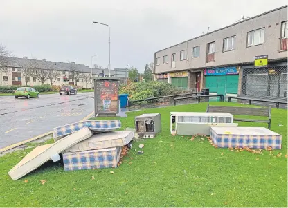  ?? Picture: Steven Brown. ?? Fly-tippers left the mess on a grassed area on nearest recycling centre at Cable Road. Church Street, Glenrothes, two miles from the