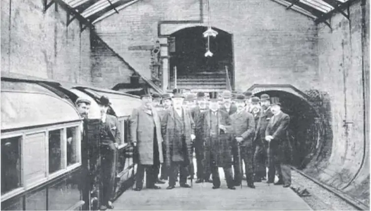  ??  ?? 0 Officials gather for a photograph on the opening day of the Glasgow District Subway system