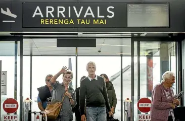  ?? BRADEN FASTIER/ STUFF ?? Nettie and Ben Verhoef arrive at Nelson Airport yesterday. Masks are no longer required on domestic flights, but the Verhoefs wore them on the last leg home out of habit.