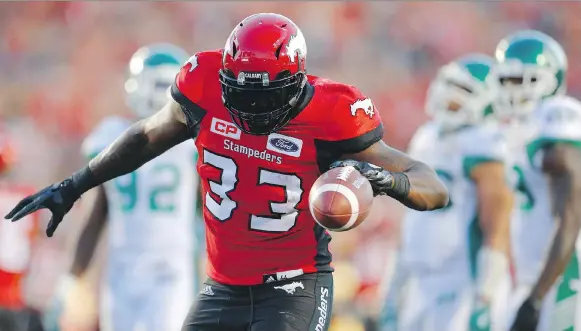  ?? AL CHAREST ?? Running back Jerome Messam, shown scoring a touchdown with the Calgary Stampeders last season, has signed as a free agent with the Roughrider­s.