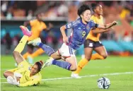  ?? JUAN MENDEZ/ASSOCIATED PRESS ?? Japan’s Riko Ueki, right, is fouled by Zambia’s Catherine Musonda during their Women’s World Cup Group C match Saturday in Hamilton, New Zealand.