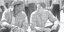  ?? MICHAEL WEINSTEIN ?? Red (Morgan Freeman) and Andy (Tim Robbins) discover the power of hope in The Shawshank Redemption.
