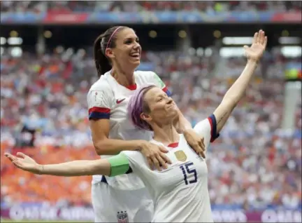 ?? FRANCISCO SECO - THE ASSOCIATED PRESS ?? United States’ Megan Rapinoe, right, celebrates after scoring the opening goal from the penalty spot during the Women’s World Cup final soccer match between US and The Netherland­s at the Stade de Lyon in Decines, outside Lyon, France, Sunday, July 7, 2019.