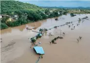 ?? ANI ?? CLIMATE DISASTER: Indian Navy conducts an aerial survey of flood-affected areas in Kadapa district of Andhra Pradesh on 20 November.