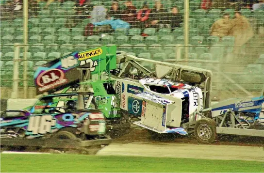  ?? PHOTO: PETER PALTRIDGE/GO SLIDEWAYS ?? Being caught out against the wall didn’t help superstock driver Ricky Dykstra, centre, as he was squeezed up the wall and onto his roof at the Arena on Saturday.