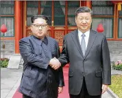  ?? KOREAN CENTRAL NEWS AGENCY ?? North Korean leader Kim Jong Un (left) shakes hands with Chinese President Xi Jinping on Tuesday during Kim’s surprise visit in Beijing.