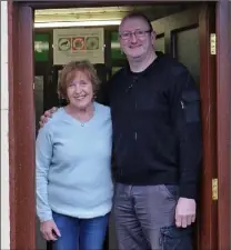  ??  ?? Post mistress Mary Long with her nephew Seamus before closing the door of Kiltealy Post office for the last time.