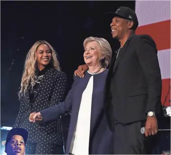  ?? JUSTIN SULLIVAN, GETTY IMAGES ?? Beyoncé and Jay-Z made campaign appearance­s with Hillary Clinton, perhaps to boost their social responsibi­lity presence.