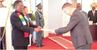  ?? ?? President Mnangagwa receives letters of credence from the Belarusian Ambassador designate to Zimbabwe Mr Ihar Marshalau at State House in Harare yesterday. Picture: Justin Mutenda