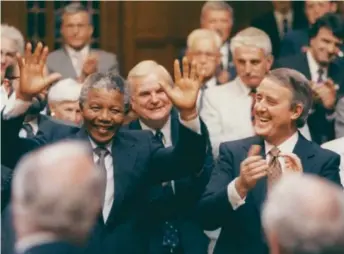  ?? PMO photo ?? Nelson Mandela and Prime Minister Brian Mulroney in the House of Commons in June 1990. Freed after 27 years in prison, Mandela chose Canada’s Parliament as the first he addressed because of Canada’s fight against apartheid and Mulroney’s championin­g of...