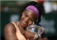  ?? MICHEL EULER — THE ASSOCIATED PRESS FILE ?? In this file photo, Serena Williams holds the trophy after winning the final of the French Open tennis tournament against Lucie Safarova of the Czech Republic, at the Roland Garros stadium in Paris, France. Welcome back to Paris, Serena Williams. The tennis world can’Äôt wait to find out exactly how that bothersome left knee is holding up.