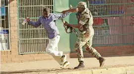  ?? Picture: AFP ?? BRUTAL. A Zimbabwean soldier beats a man in a street of Harare yesterday as protests erupted over alleged fraud in the election.