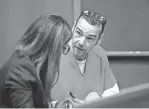  ?? MANDI WRIGHT/DETROIT FREE PRESS ?? Attorney Mariell Lehman, left, speaks to her client, James Crumbley, father of the Oxford High School shooter, in the Oakland County courtroom of Judge Cheryl Matthews on Dec. 13.