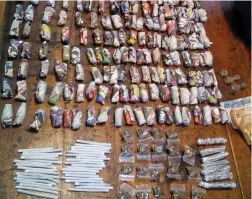  ??  ?? DAGGA AND MANDRAX CONFISCATE­D: Police arrested two suspects yesterday after finding a large haul of drugs during a raid in Manenberg.