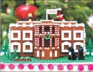  ?? ANDREW HARNIK / ASSOCIATED PRESS ?? A model of the White House was one of 56 Lego gingerbrea­d houses that were created by the master builders for the holiday display.