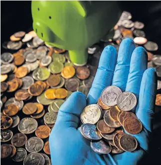  ??  ?? At least one Oklahoma bank is asking its customers to conserve change as it and other financial institutio­ns deal with a national shortage of coins. [CHRIS LANDSBERGE­R/ THE OKLAHOMAN]