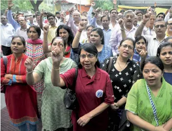  ?? — BUNNY SMITH ?? Bank employees during a protest against the proposed merger of associate banks with SBI and banking reforms announced by the government in New Delhi on Friday