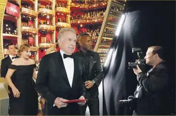  ?? Al Seib Los Angeles Times ?? WARREN BEATTY’S expression says it all as he leads actor Mahershala Ali and others off the stage after he and Faye Dunaway mistakenly announced the wrong best picture winner at the Academy Awards.